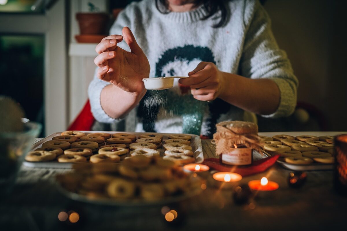 A piping bag being filled with icing